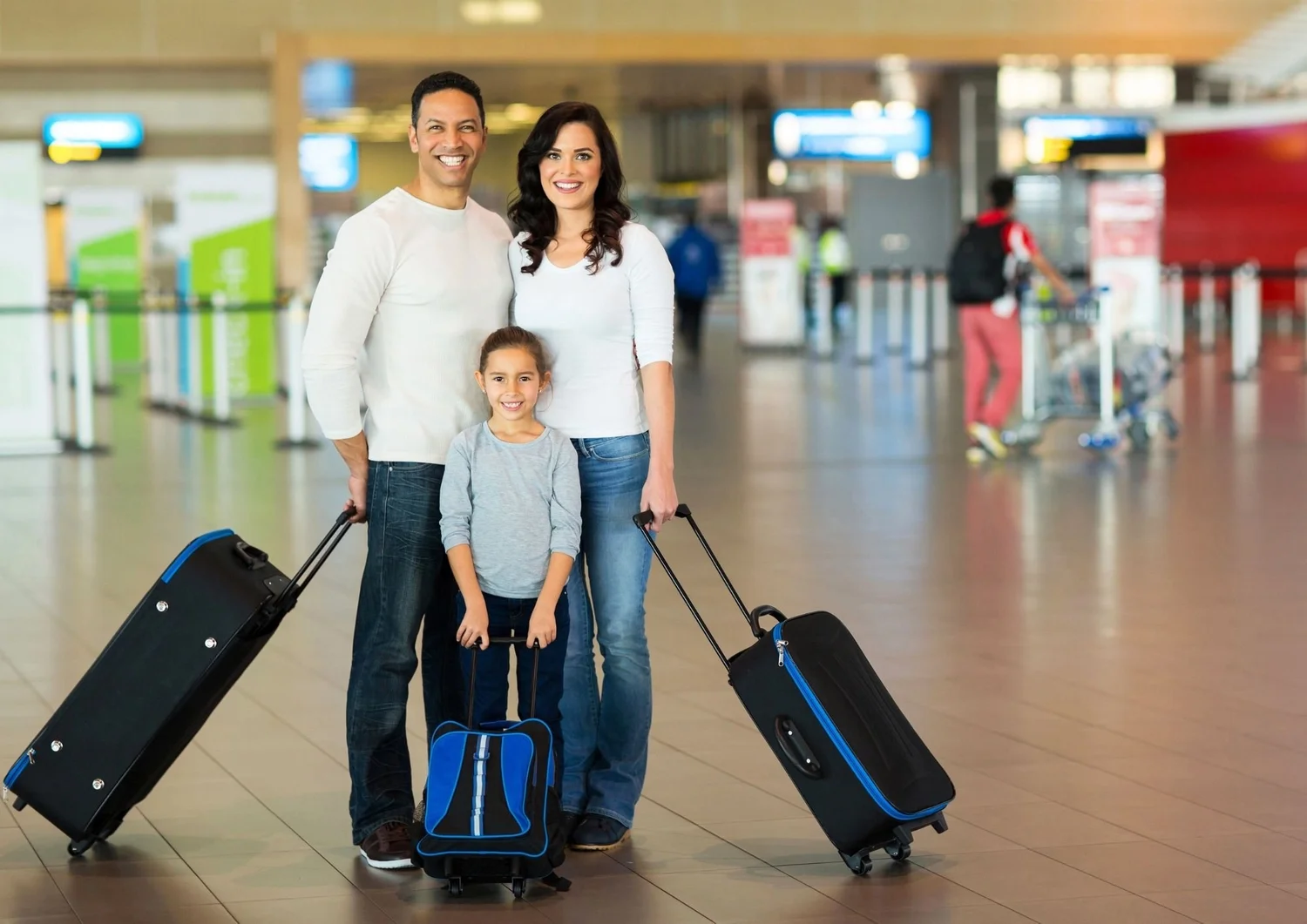 Two people with suitcases